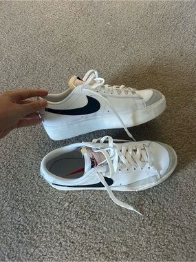Nike White Sneakers with Black Swoosh and Gray Toe Accents